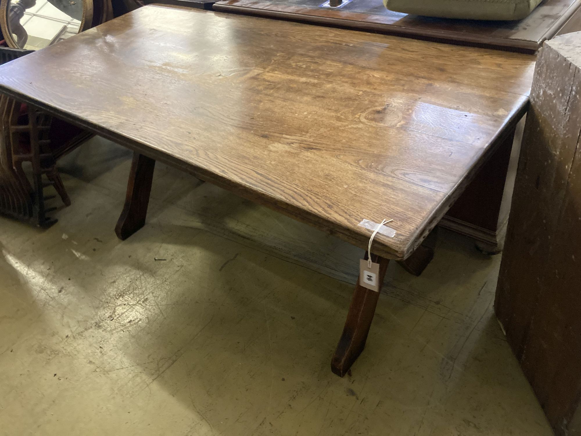 An early 20th century rectangular oak X frame refectory dining table, length 167cm, depth 80cm, height 75cm